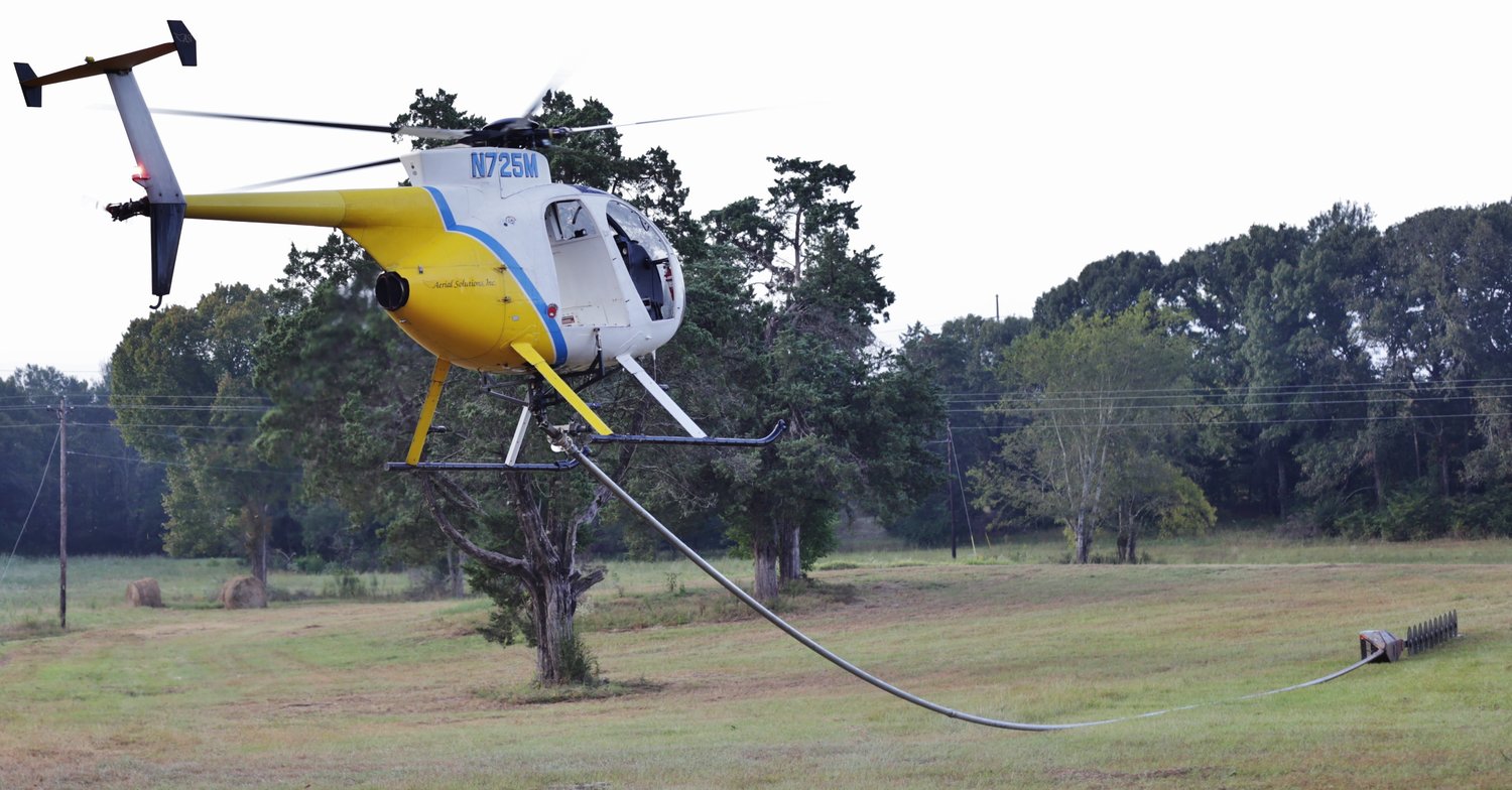 An Aerial Solutions helicopter takes off from a local pasture to begin the day’s cutting between Mineola and Grand Saline.